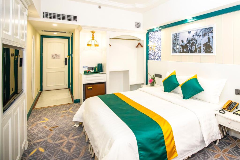 Postel nebo postele na pokoji v ubytování Fu Hua Hotel