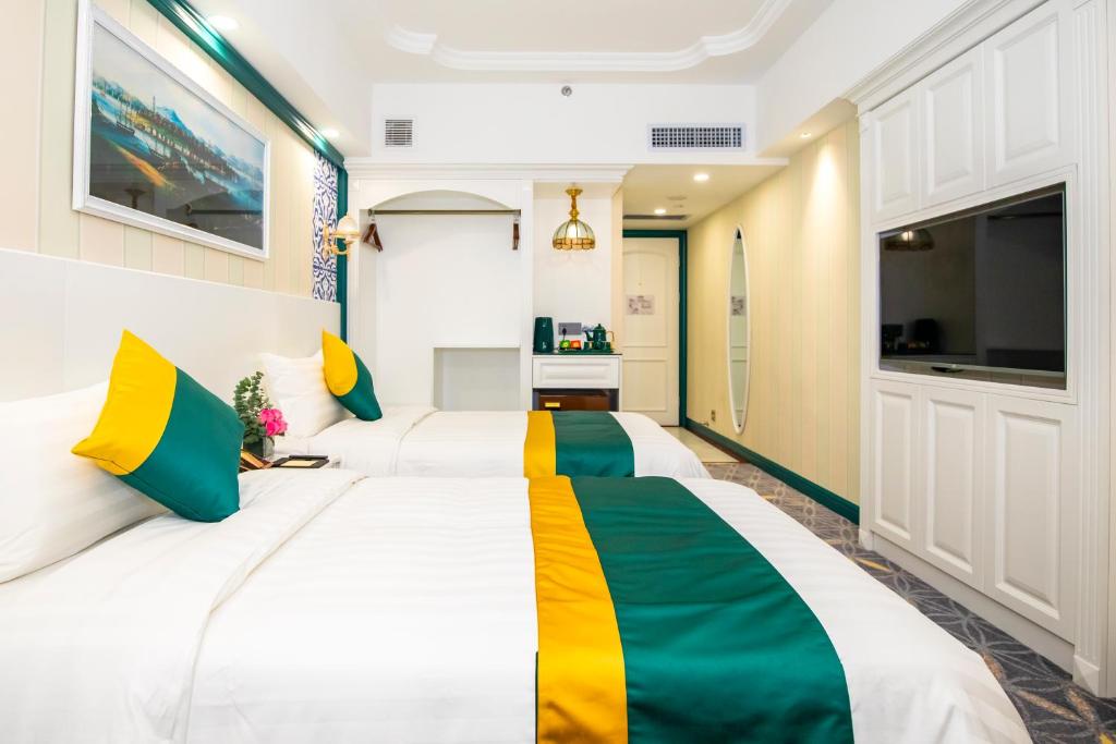 Postel nebo postele na pokoji v ubytování Fu Hua Hotel