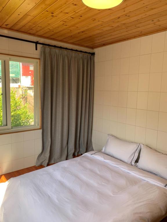 Postel nebo postele na pokoji v ubytování Taomi Diary