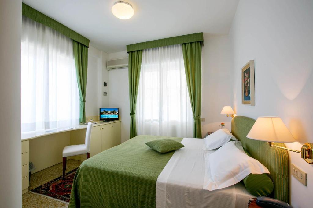 Postel nebo postele na pokoji v ubytování Hotel Mion Charme & Relax
