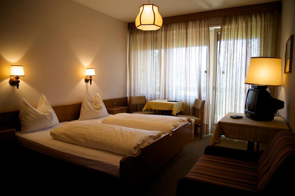 Postel nebo postele na pokoji v ubytování Hotel Tannerhof