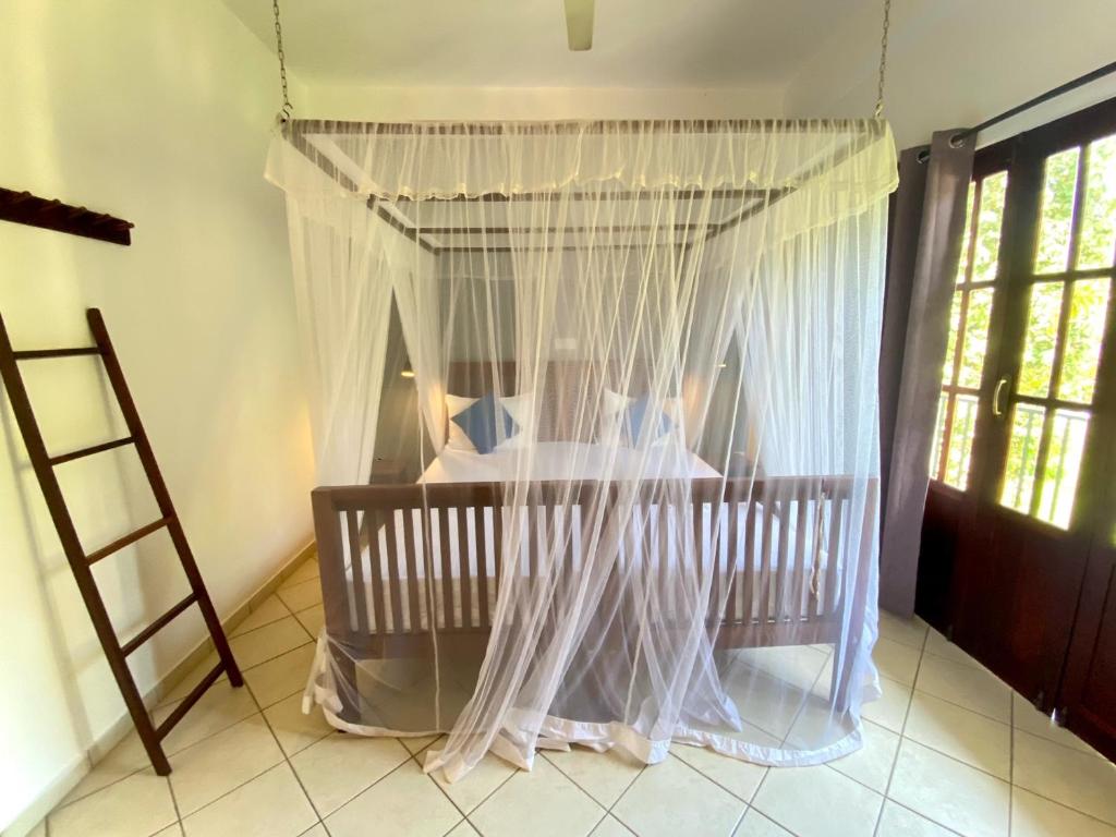 Postel nebo postele na pokoji v ubytování Unawatuna Nor Lanka Hotel