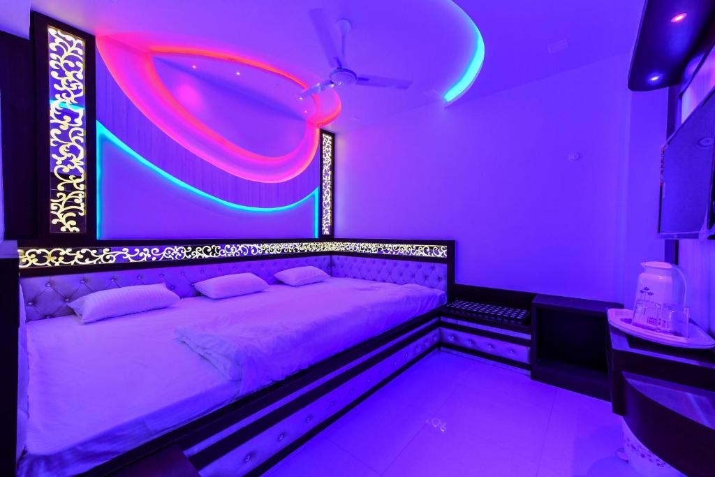 Postel nebo postele na pokoji v ubytování HN Palace Homestay