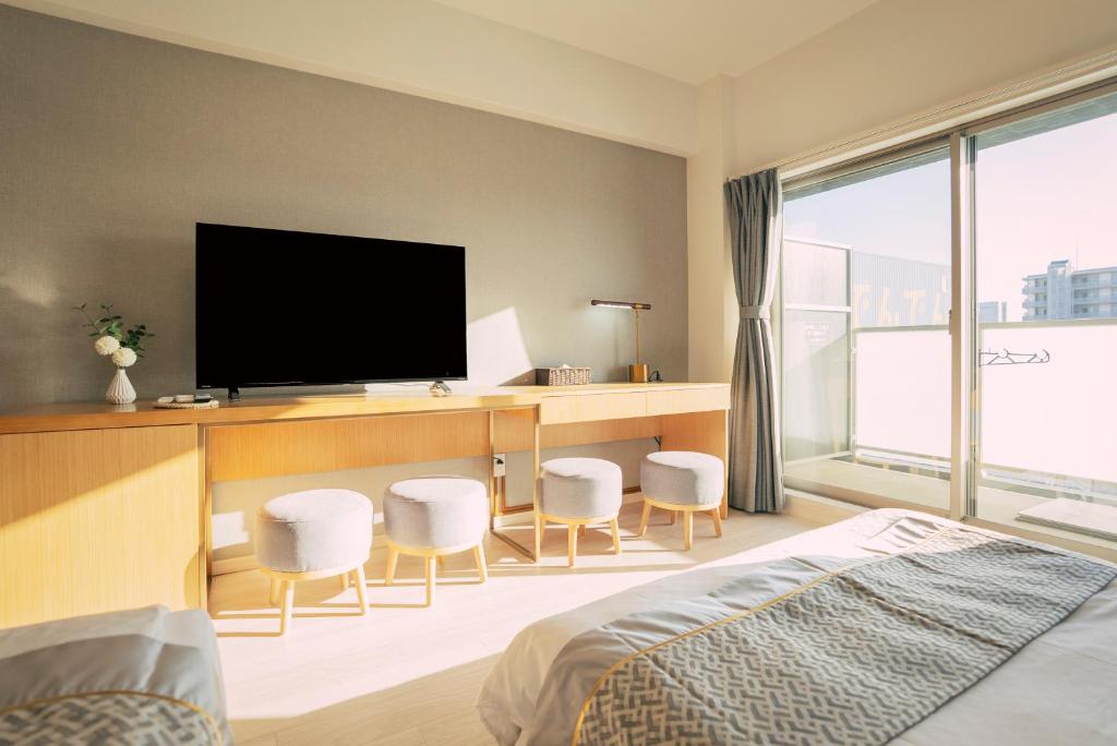 TV a/nebo společenská místnost v ubytování 谷町君 HOTEL 恵美須町72