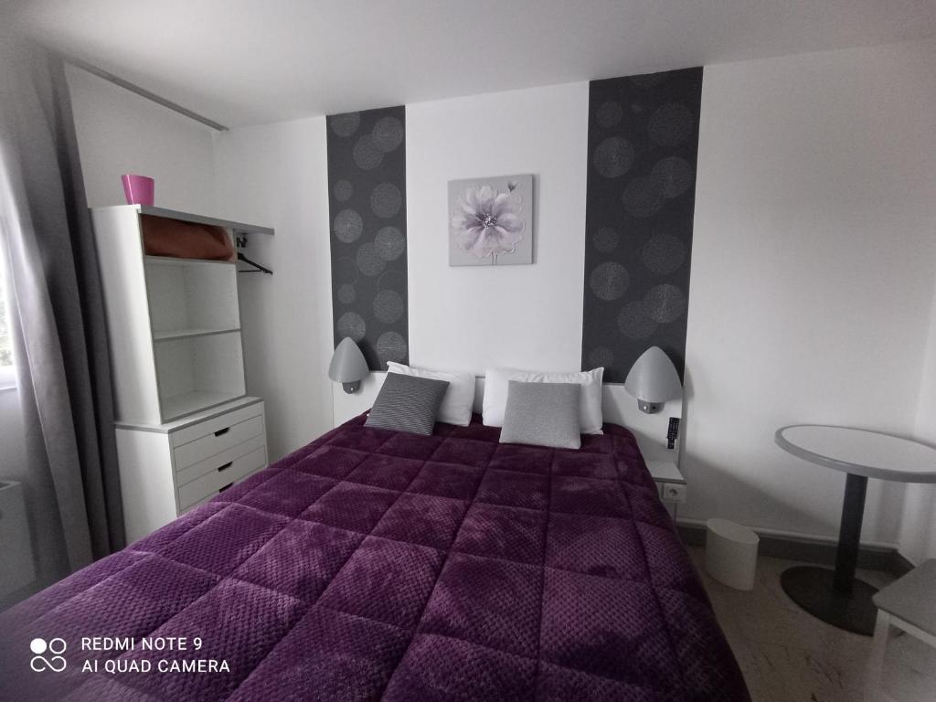 Postel nebo postele na pokoji v ubytování hotel l'échappée d'oléron