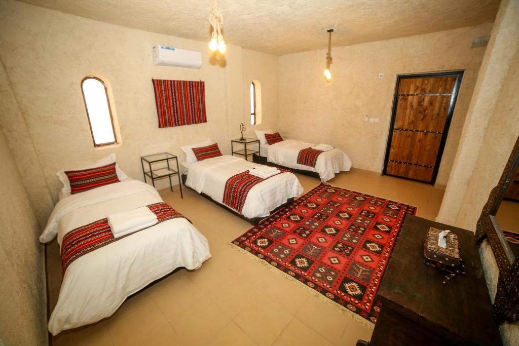 Postel nebo postele na pokoji v ubytování Sinam Desert Resort