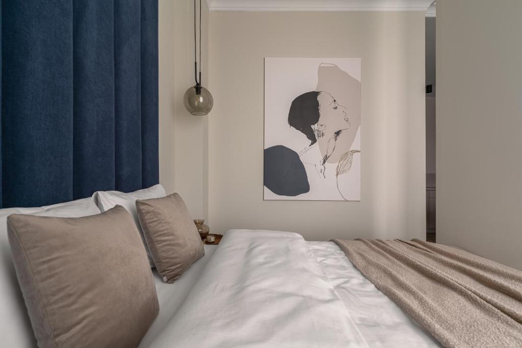 Posteľ alebo postele v izbe v ubytovaní APARTIO ROOMS Katowice