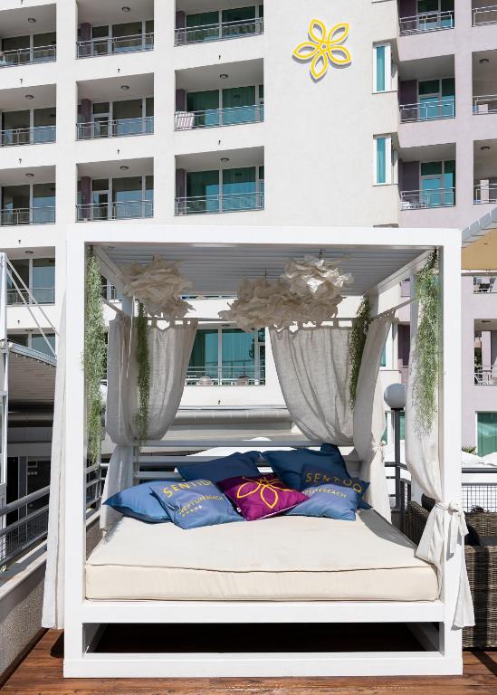 Postel nebo postele na pokoji v ubytování Hotel Neptun Beach