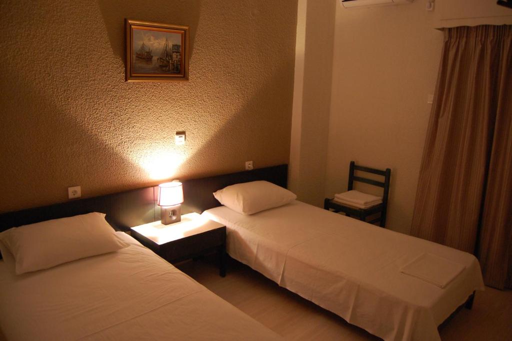 Postel nebo postele na pokoji v ubytování Hotel Antirriο