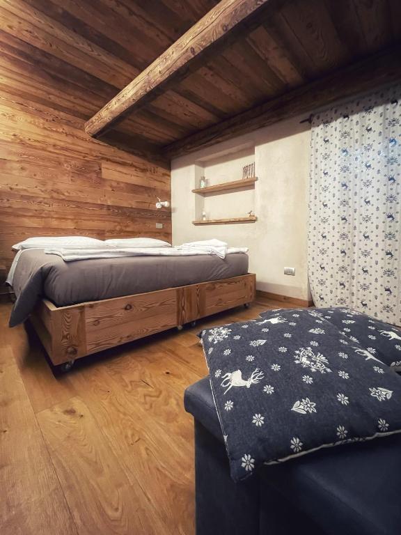 Postel nebo postele na pokoji v ubytování Amelu'