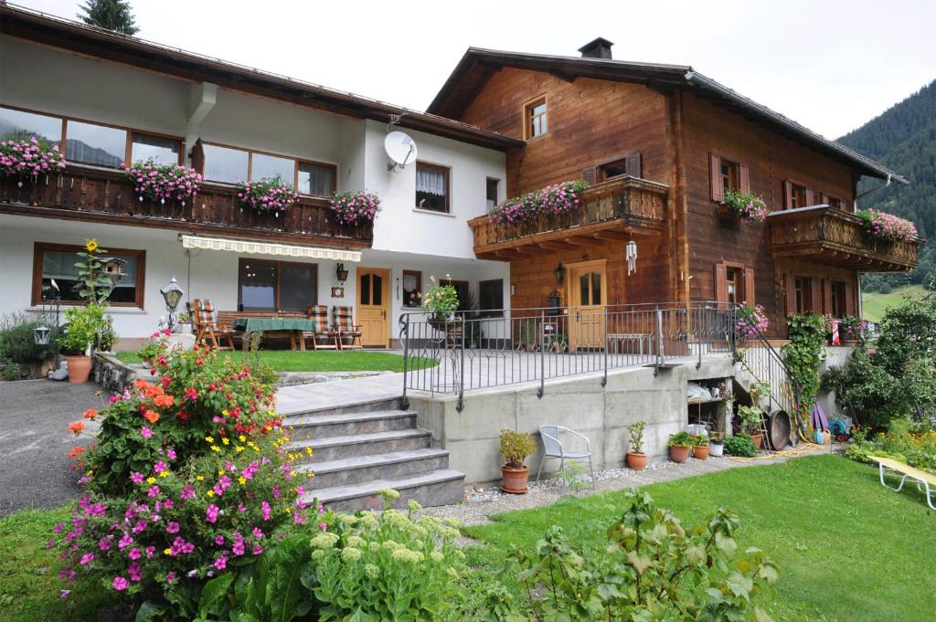 a house with flowers in front of it at Haus Schönlechner in Gaschurn