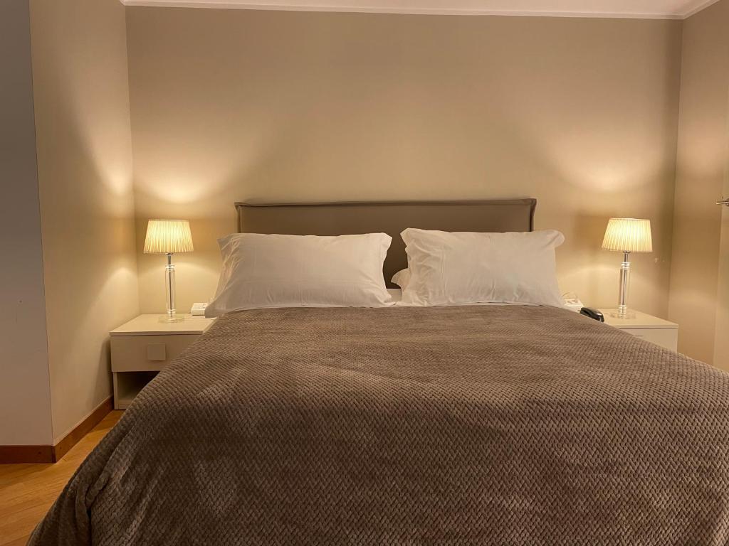 Postel nebo postele na pokoji v ubytování Hotel Europa