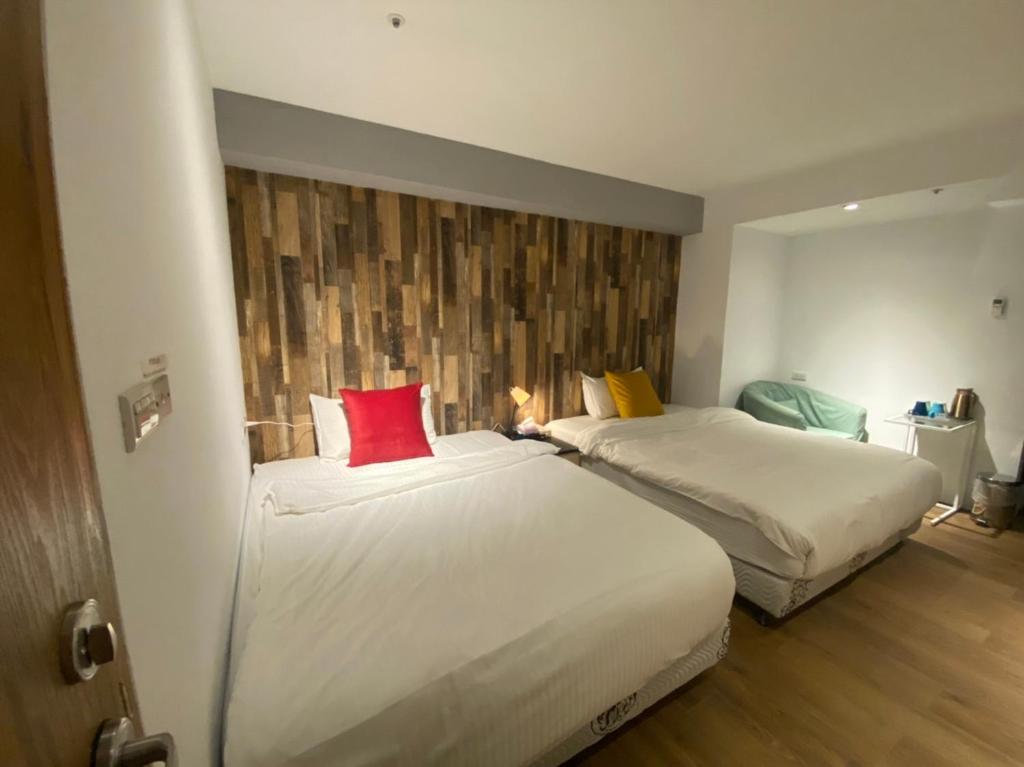 Postel nebo postele na pokoji v ubytování M Taipei Hotel