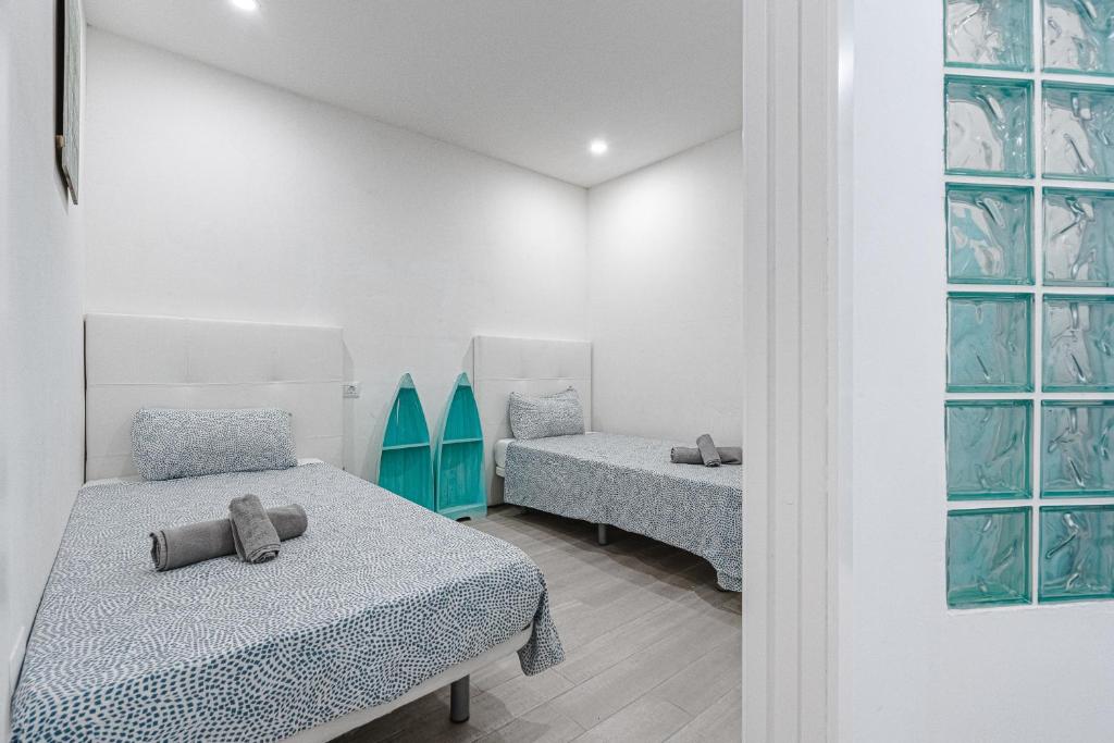 Posteľ alebo postele v izbe v ubytovaní APARTAMENTO DE LUJO EN MARE VERDE