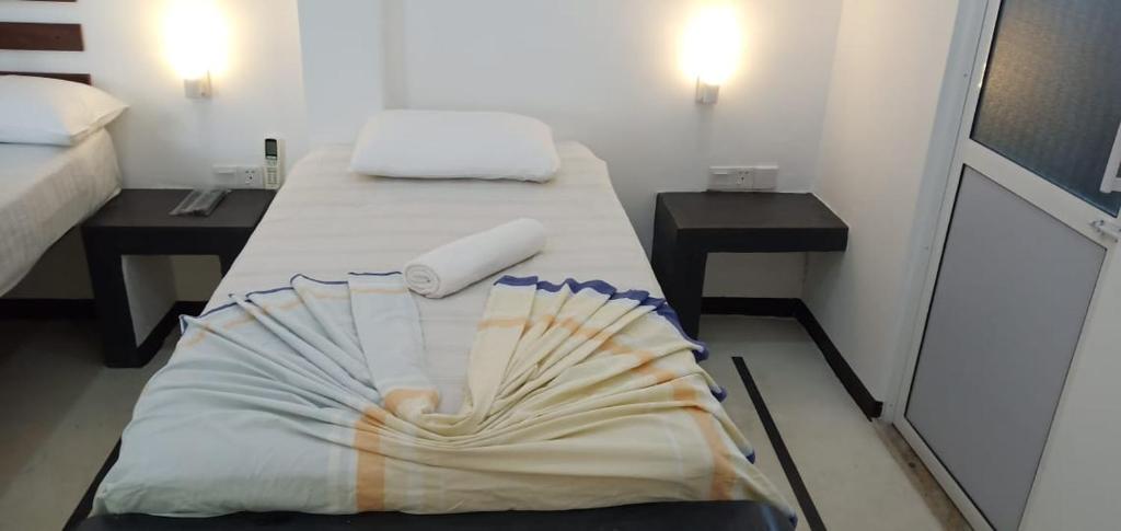Postel nebo postele na pokoji v ubytování Petit Guest House