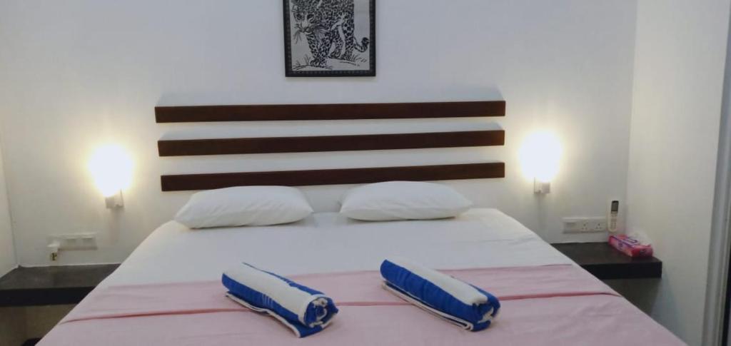 Postel nebo postele na pokoji v ubytování Petit Guest House