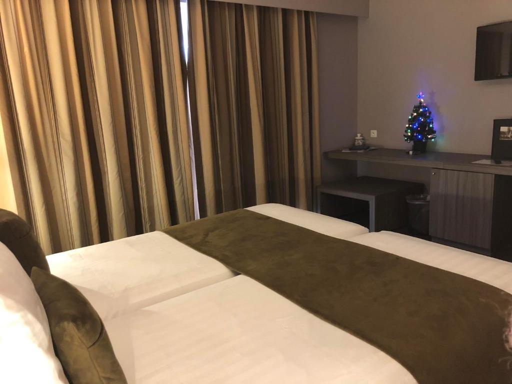 Postel nebo postele na pokoji v ubytování Hotel Gemeente Huis