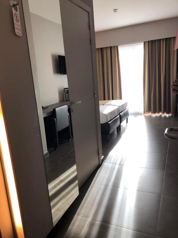 TV a/nebo společenská místnost v ubytování Hotel Gemeente Huis