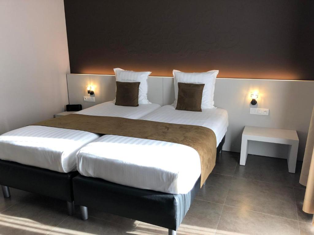 Postel nebo postele na pokoji v ubytování Hotel Gemeente Huis