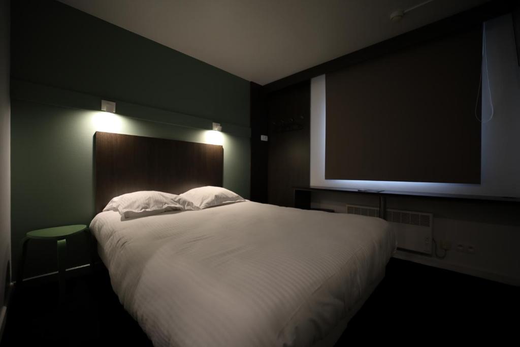 Postel nebo postele na pokoji v ubytování Travel Hotel Kruisem