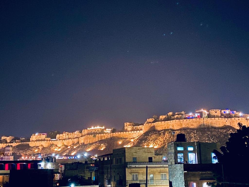 a view of the acropolis at night at Mirvana Guest House & Camel safari in Jaisalmer
