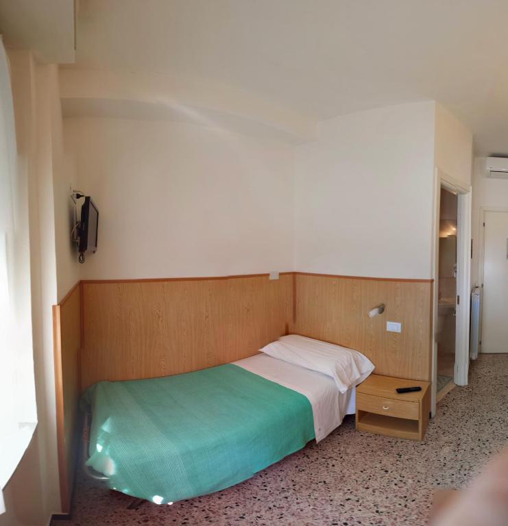 Posteľ alebo postele v izbe v ubytovaní Albergo Anita