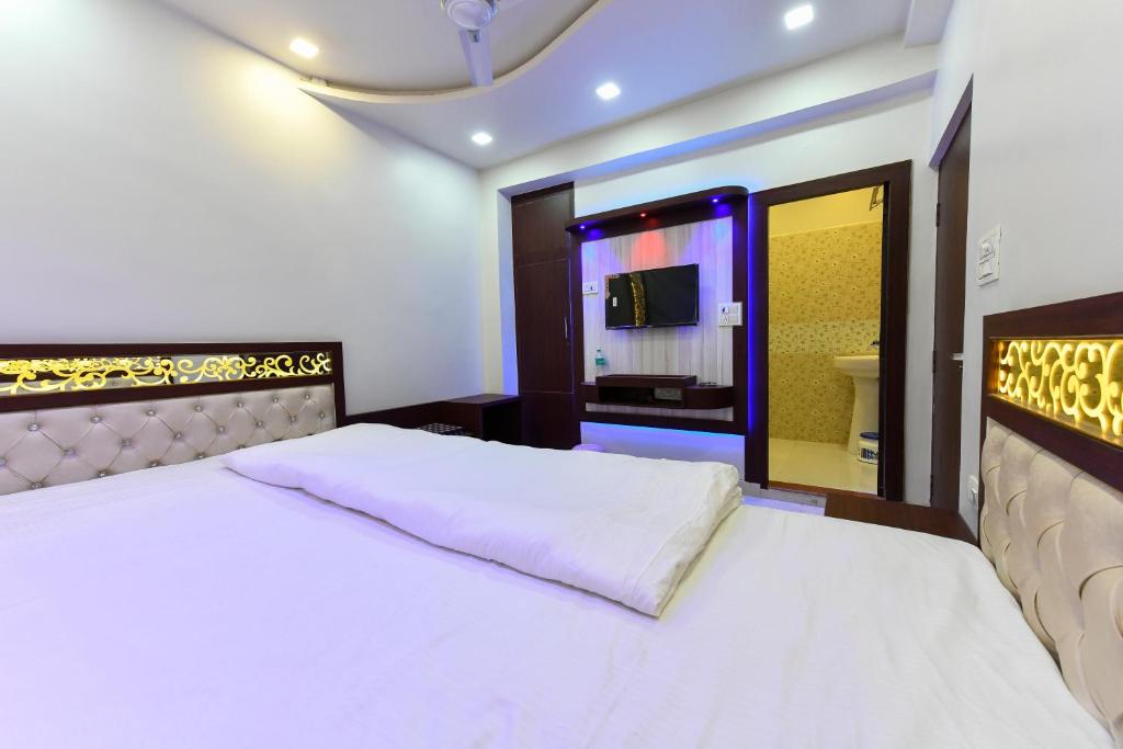 Postel nebo postele na pokoji v ubytování HN Palace Homestay