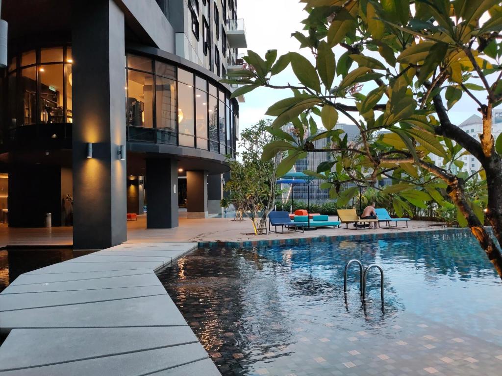 a swimming pool in the middle of a building at Ai Smart Home , Bangsar South in Kuala Lumpur
