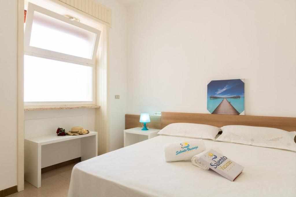 Łóżko lub łóżka w pokoju w obiekcie VILLA ISCHIA