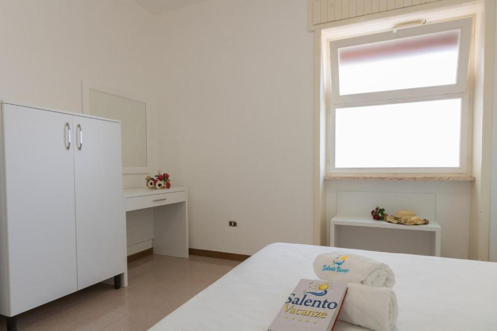 Łóżko lub łóżka w pokoju w obiekcie VILLA ISCHIA