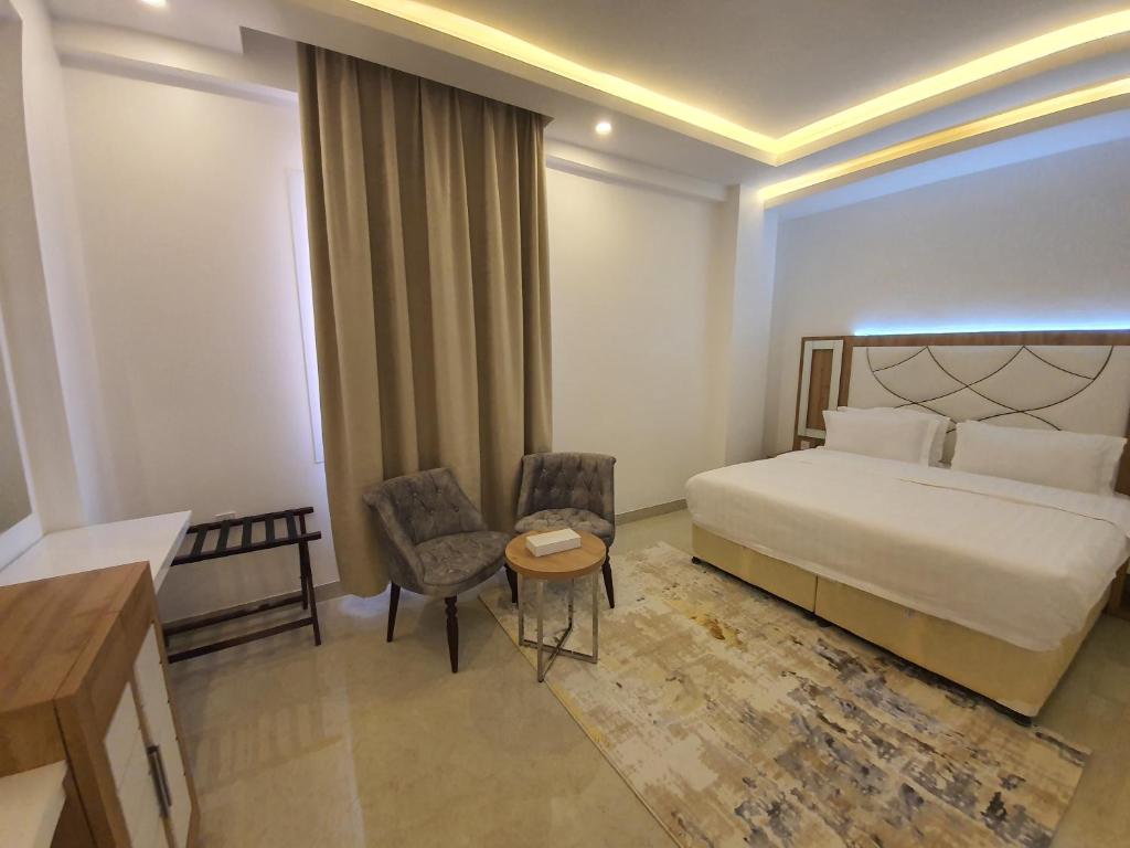 Postel nebo postele na pokoji v ubytování فندق المستقبل للشقق الفندقية ALMUSTAQBAL HOTEL Apartments