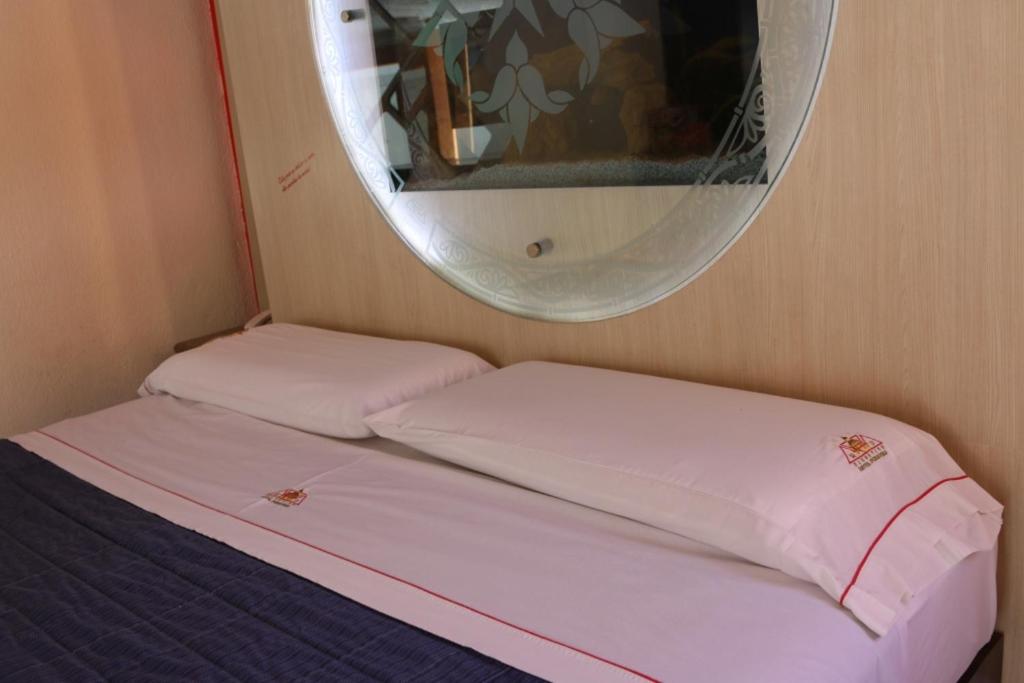 Postel nebo postele na pokoji v ubytování Motel Primavera