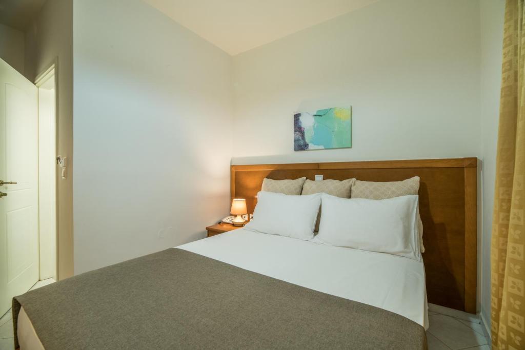 Postel nebo postele na pokoji v ubytování Hiona Holiday Hotel