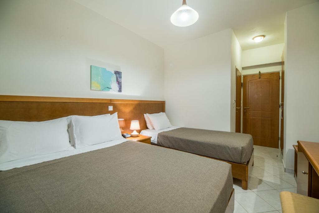 Postel nebo postele na pokoji v ubytování Hiona Holiday Hotel