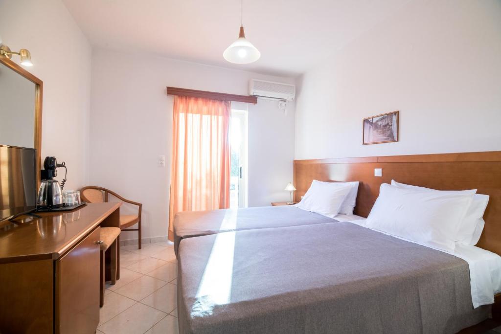 Postel nebo postele na pokoji v ubytování Hiona Holiday Hotel