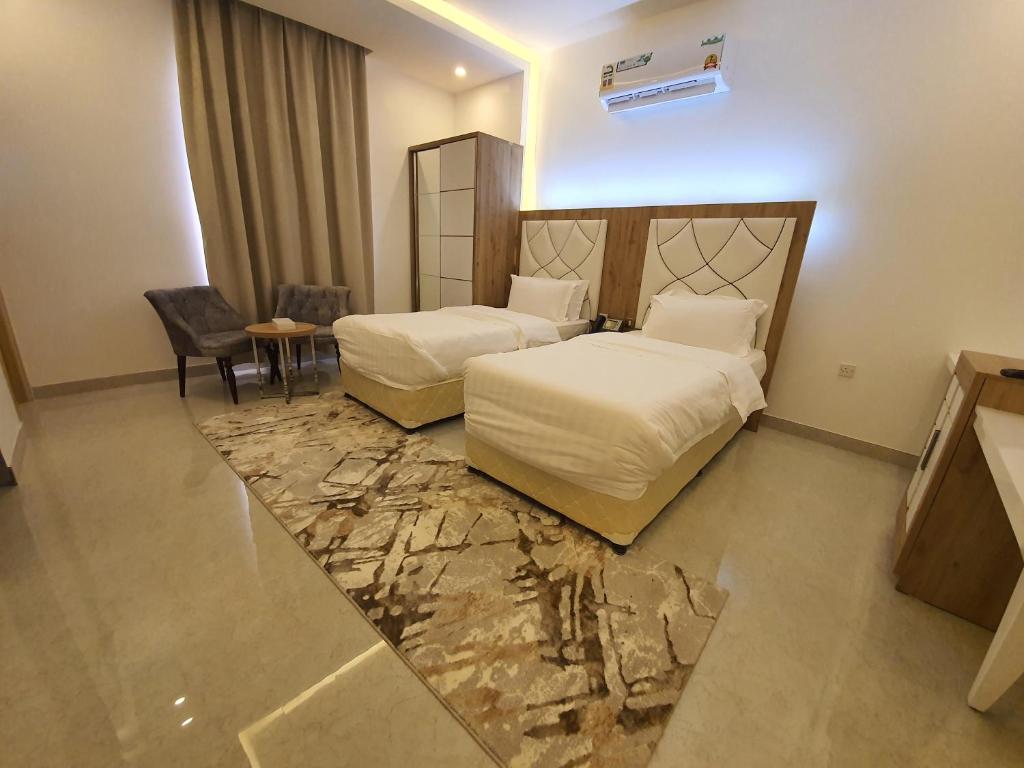 Postel nebo postele na pokoji v ubytování فندق المستقبل للشقق الفندقية ALMUSTAQBAL HOTEL Apartments