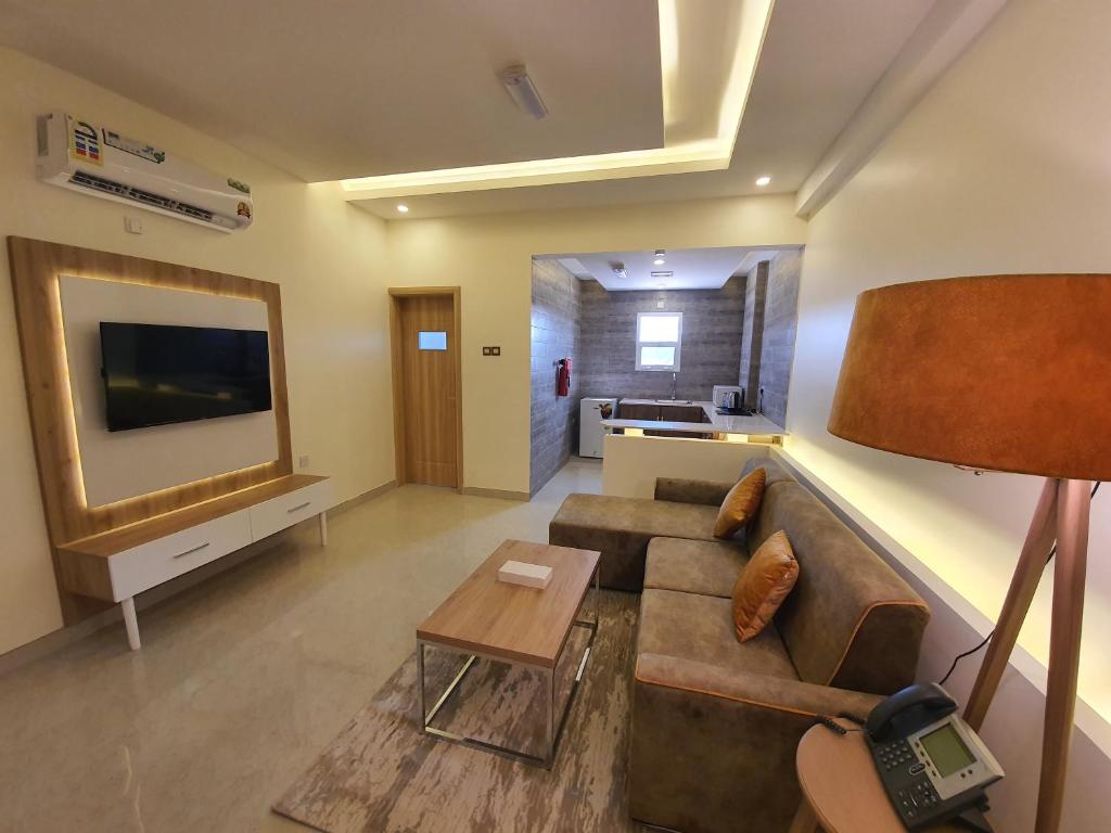TV a/nebo společenská místnost v ubytování فندق المستقبل للشقق الفندقية ALMUSTAQBAL HOTEL Apartments