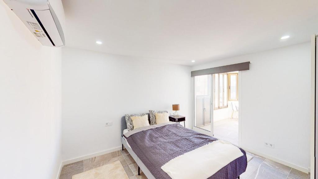 Posteľ alebo postele v izbe v ubytovaní Las Palmeras - Best Location Cozy Apartment