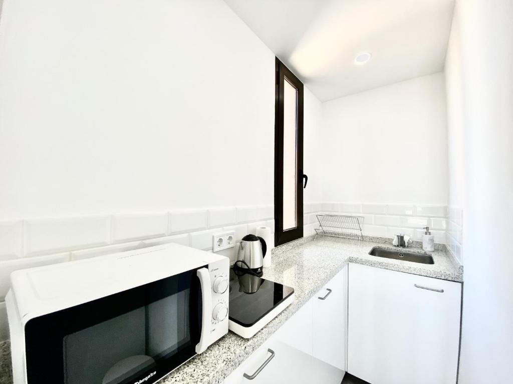 Kuchyňa alebo kuchynka v ubytovaní Las Palmeras - Best Location Cozy Apartment