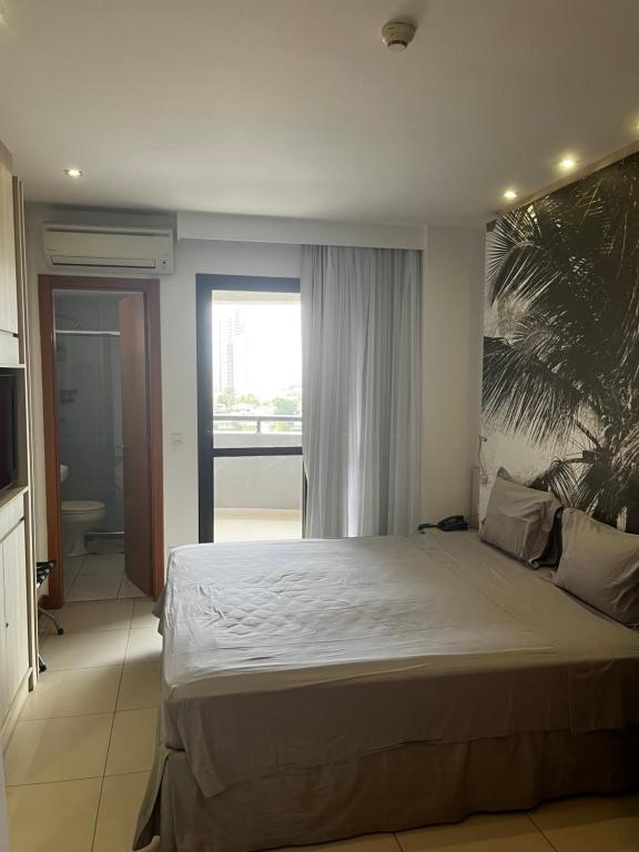 Postel nebo postele na pokoji v ubytování Studio particular em Hotel