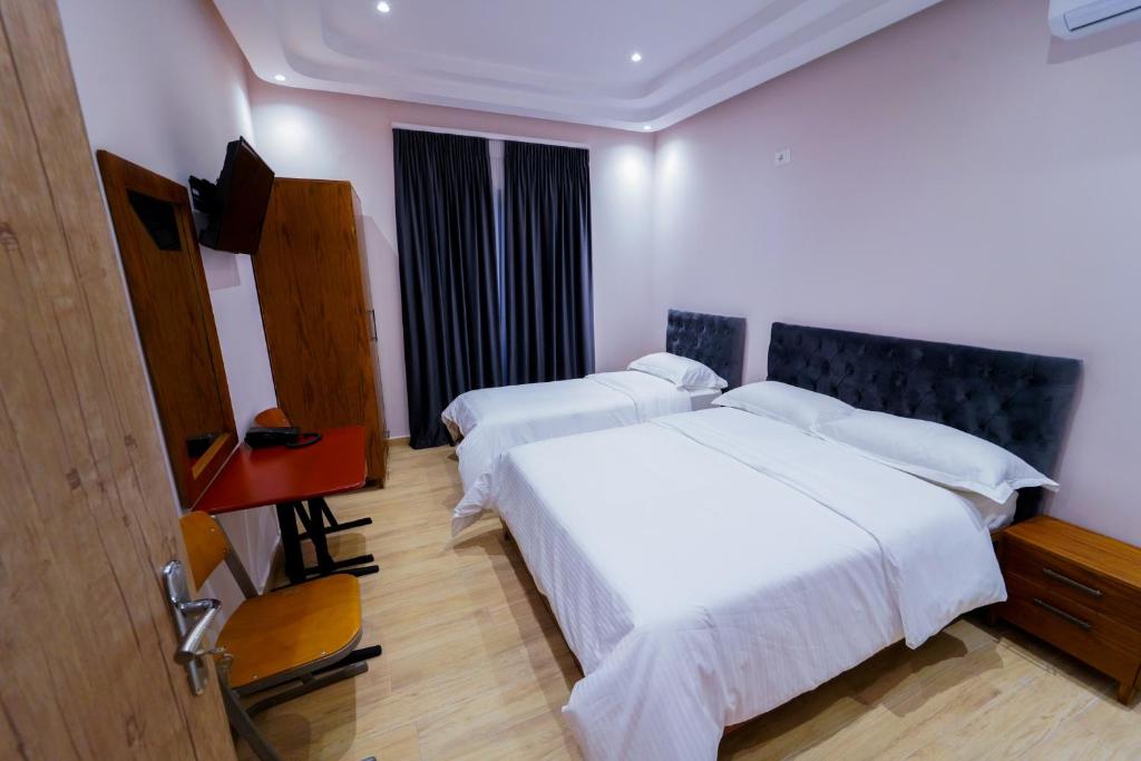 Postel nebo postele na pokoji v ubytování SR99 Hotel