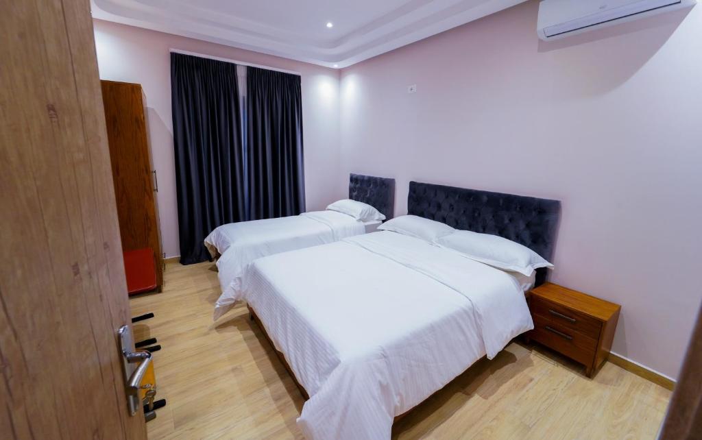 Postel nebo postele na pokoji v ubytování SR99 Hotel