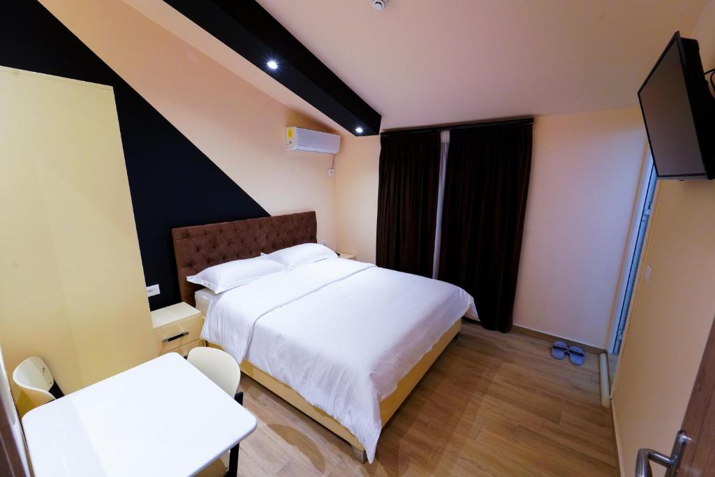 TV a/nebo společenská místnost v ubytování SR99 Hotel