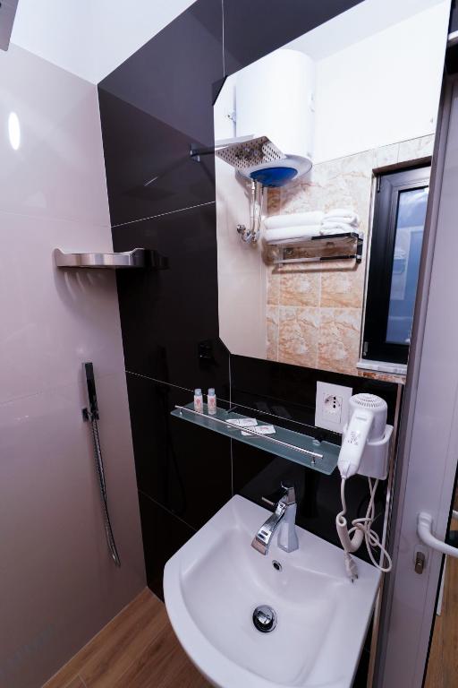 Koupelna v ubytování SR99 Hotel