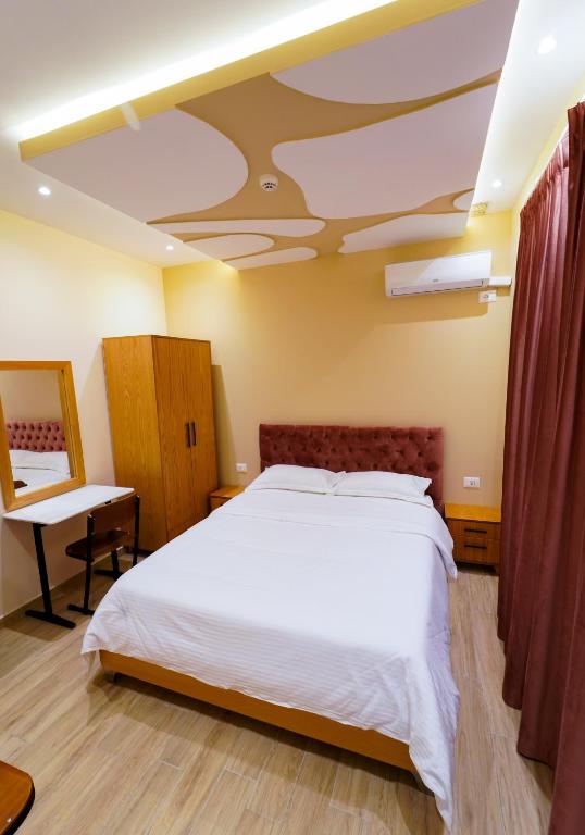 Postel nebo postele na pokoji v ubytování SR99 Hotel