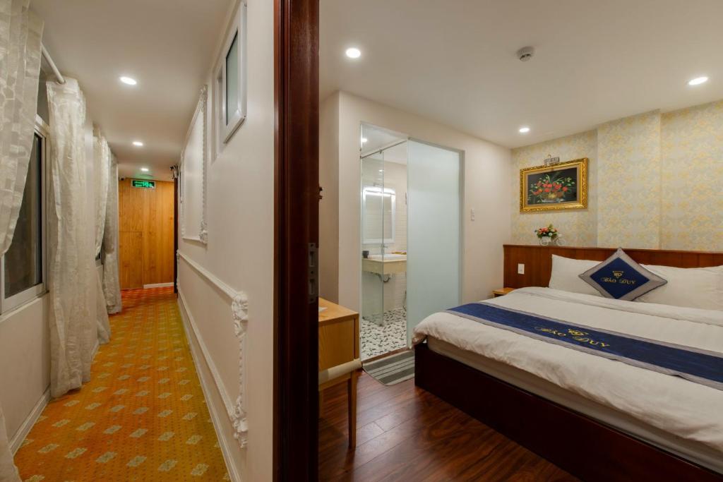 Giường trong phòng chung tại Hotel Bao Duy