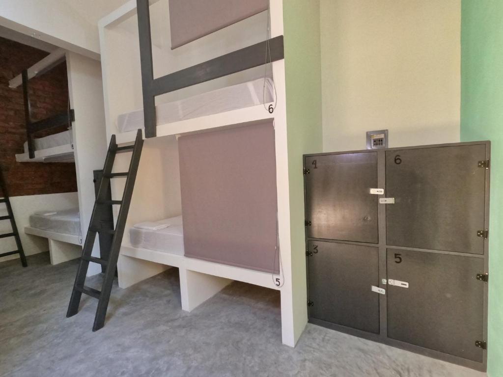 Letto o letti in una camera di Paziflora Hostel -STARLINK-
