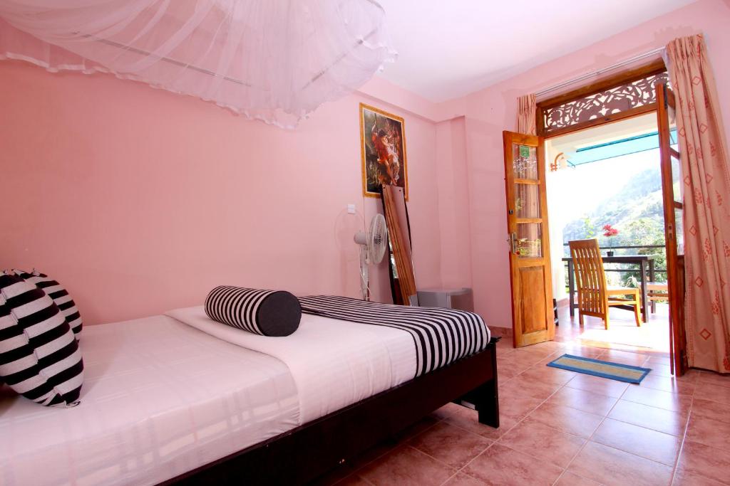 Postel nebo postele na pokoji v ubytování Blue Ribbon Homestay