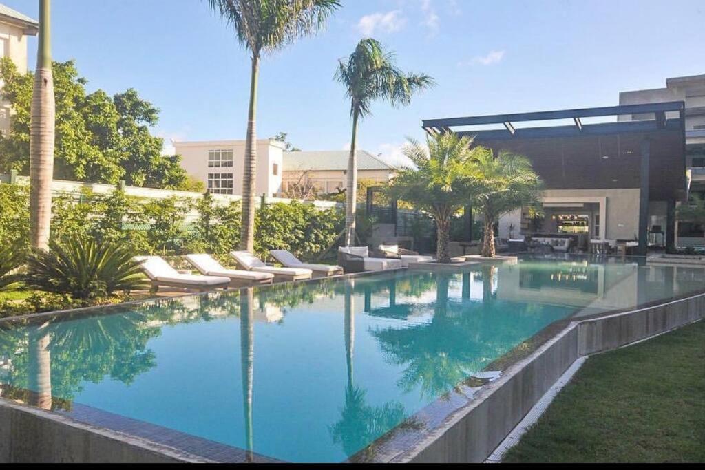 Bazén v ubytování Luxury new apartment in Cap Cana Punta Cana nebo v jeho okolí
