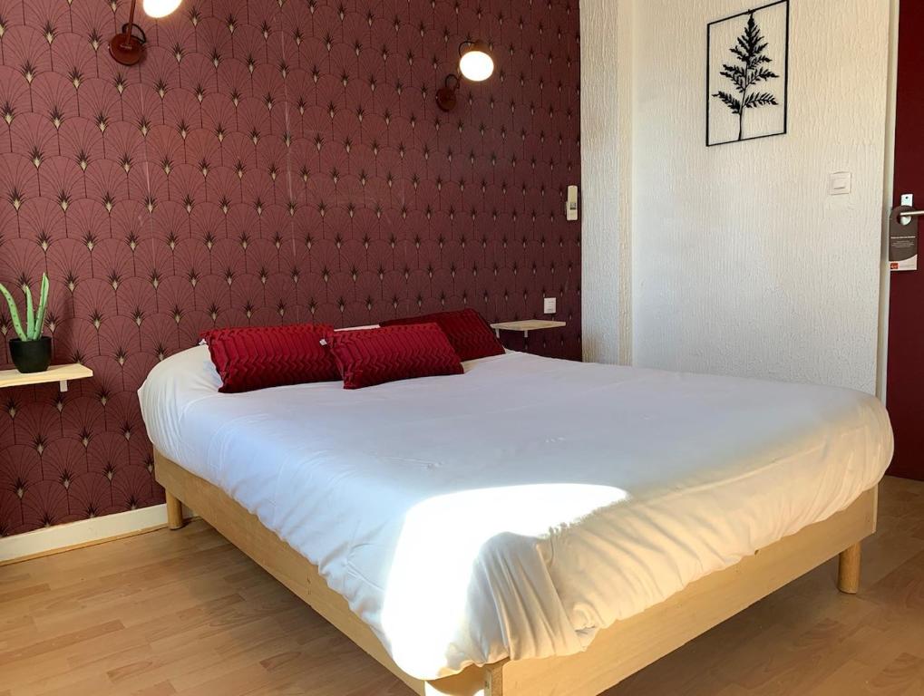 Postel nebo postele na pokoji v ubytování Hôtel le Thurot